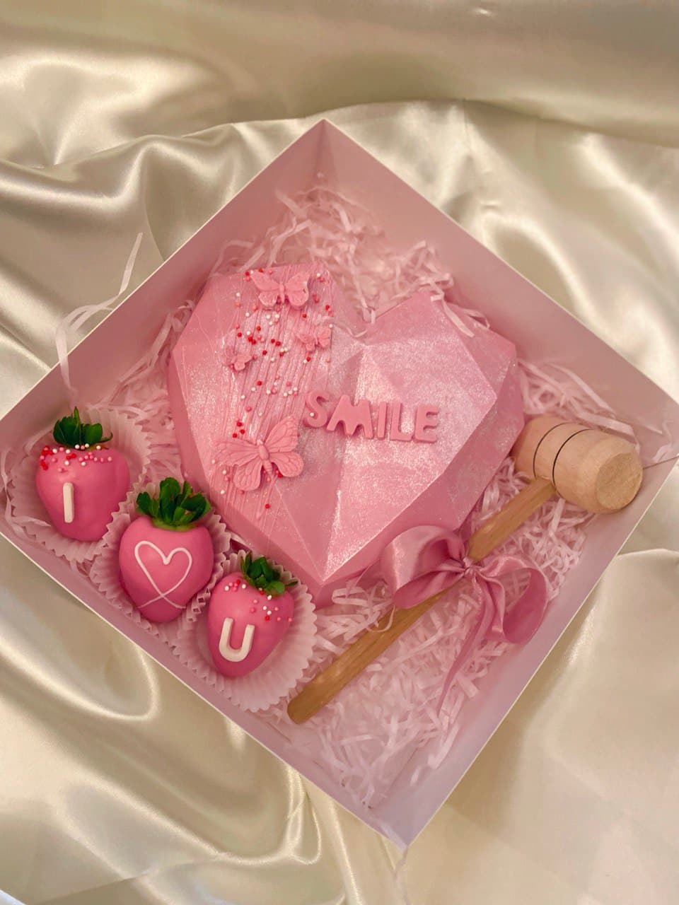 A broken heart filled with strawberries inside