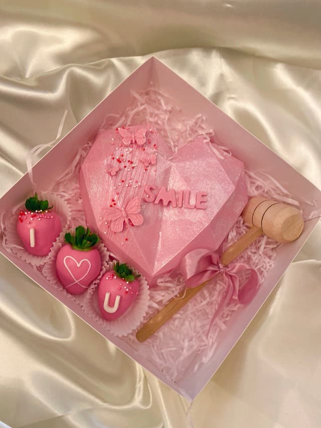 A broken heart filled with strawberries inside
