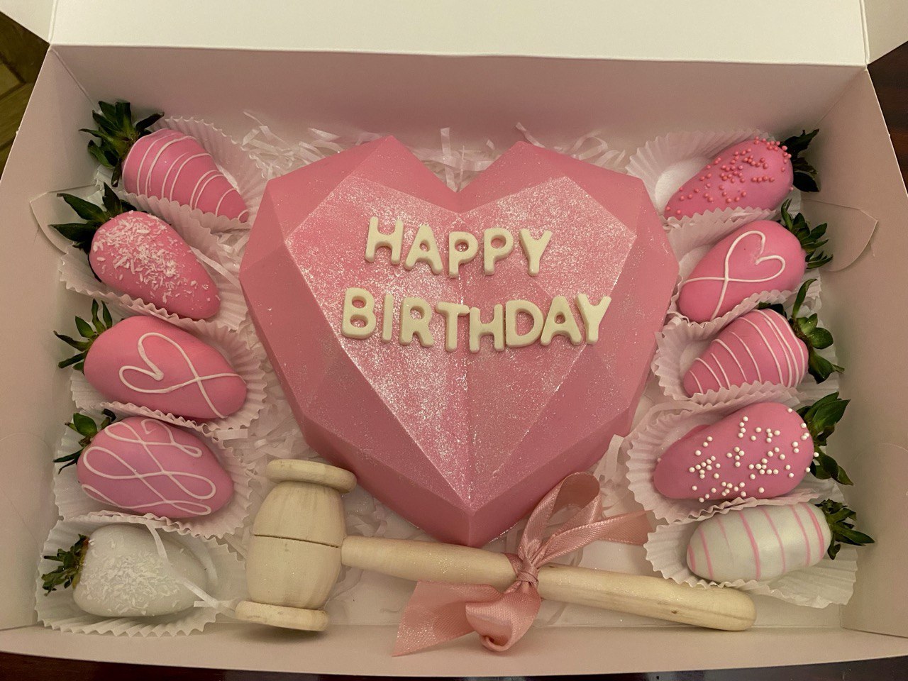 breakable chocolate heart with strawberries