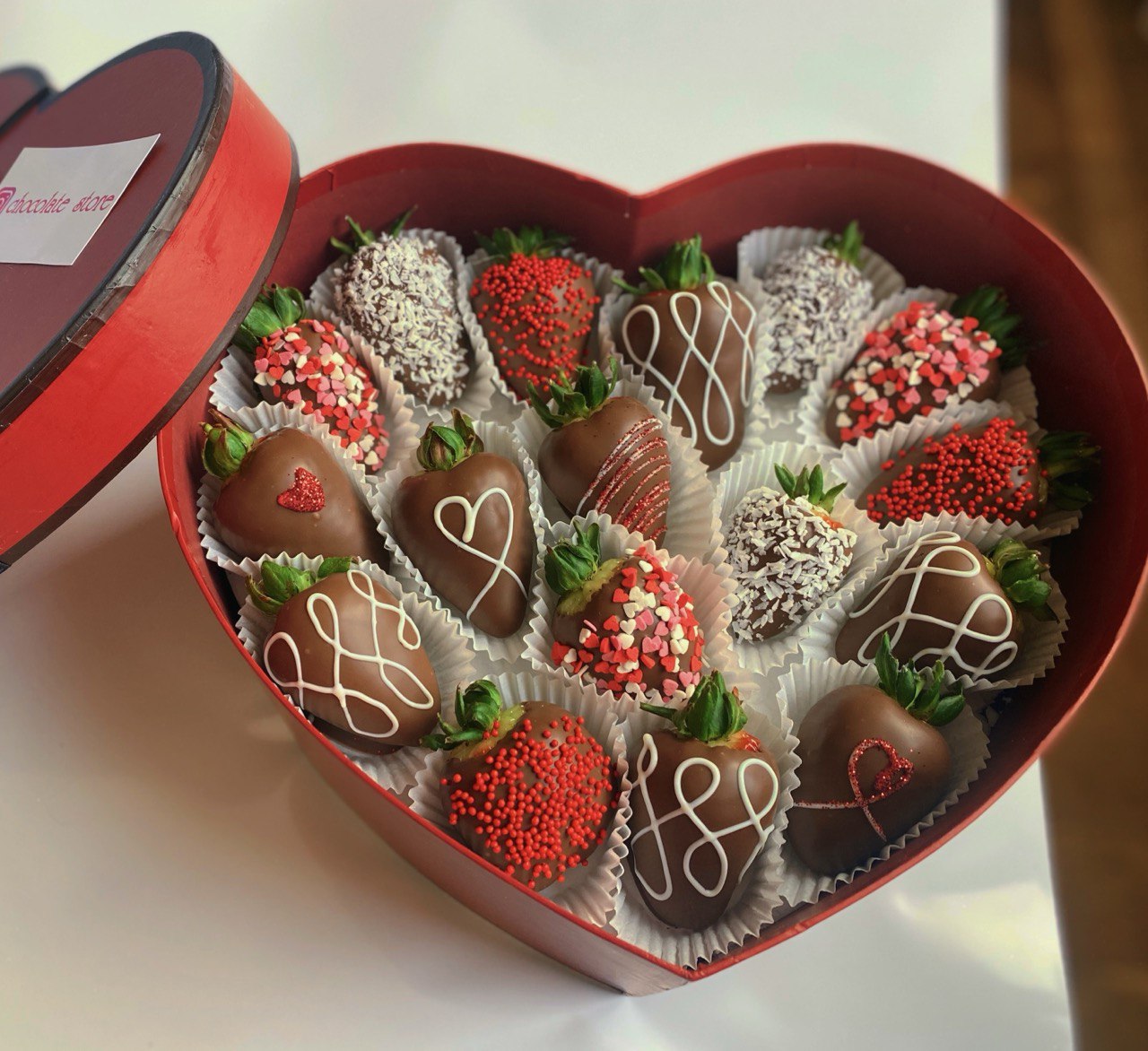 Heart-shaped box with chocolate-covered strawberries