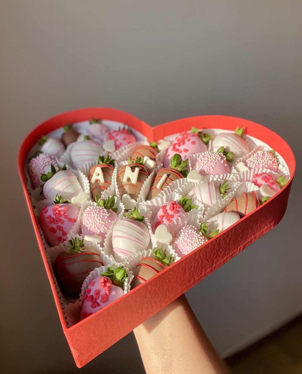 Heart-shaped box with name strawberries