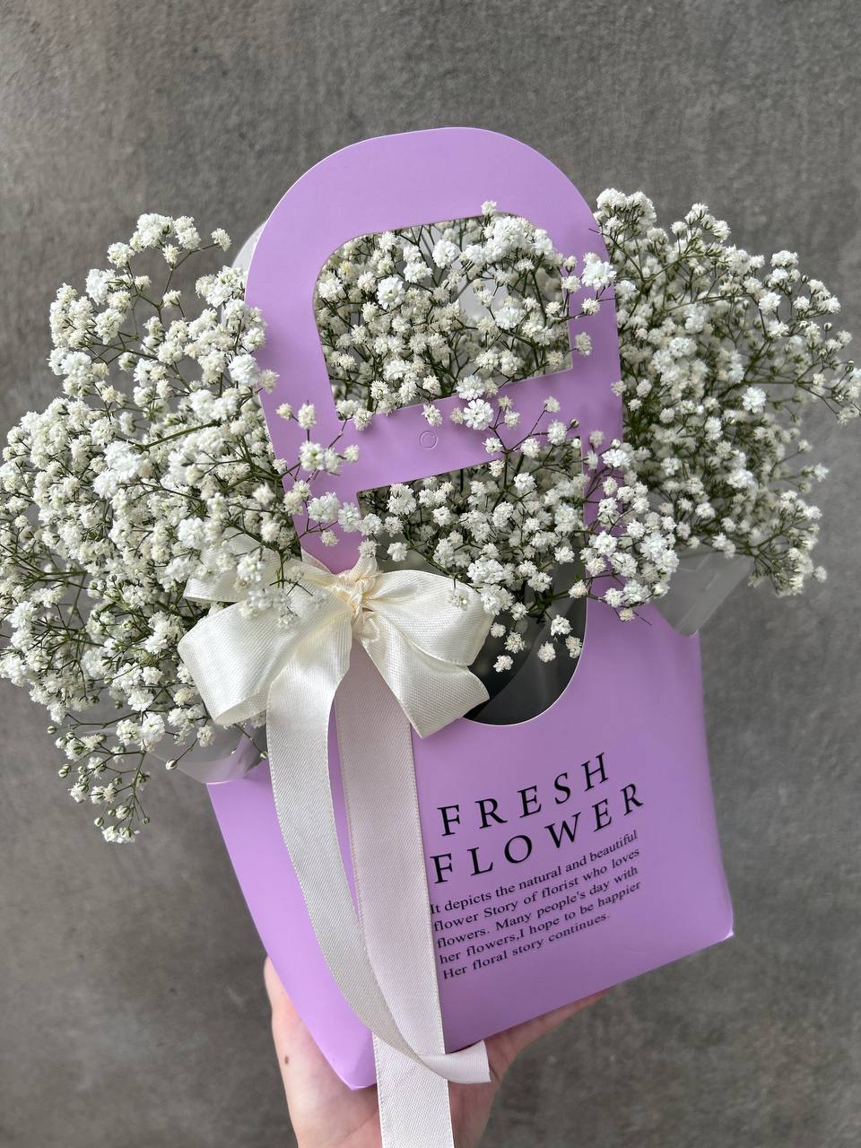 Handbag with white gypsophila