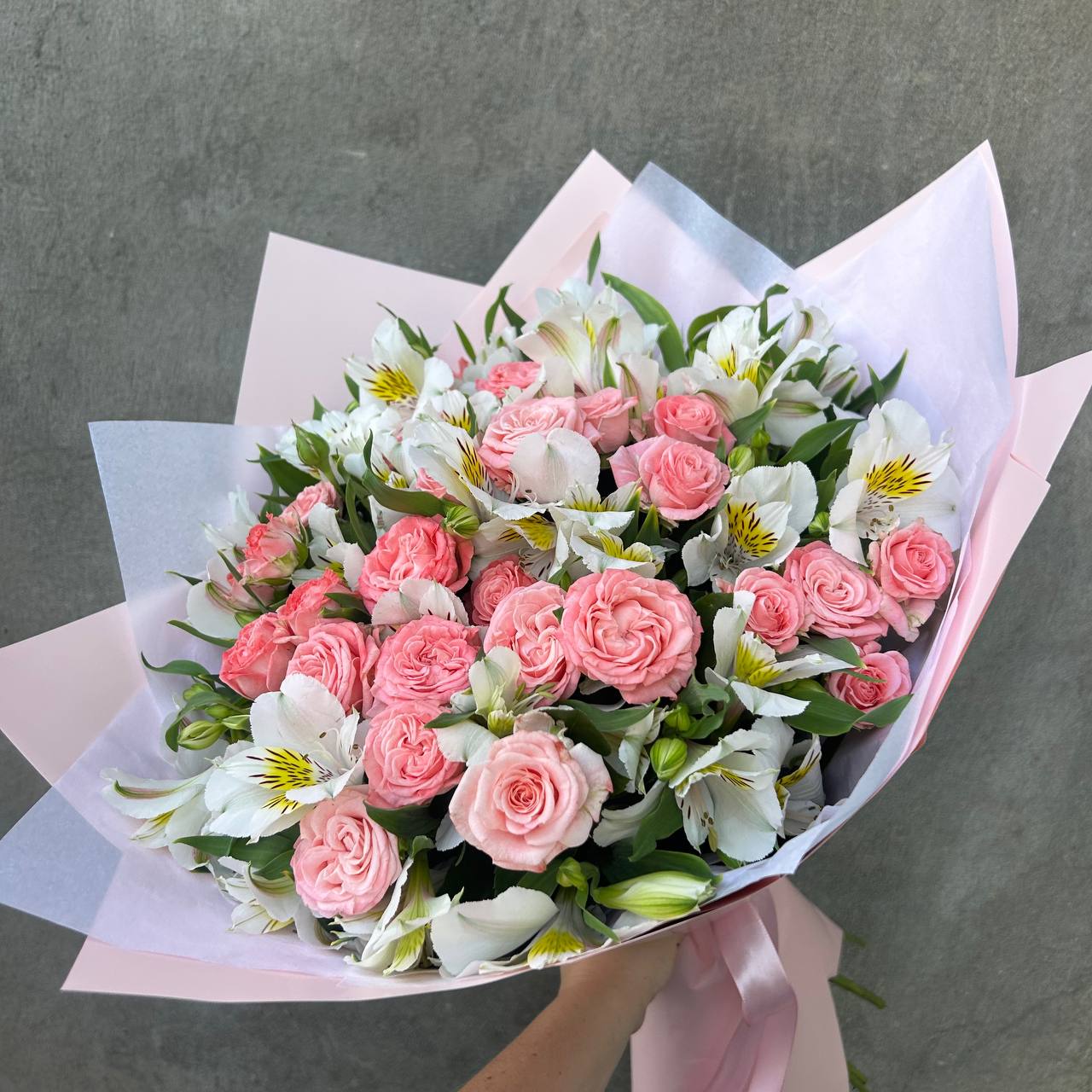 Author's bouquet of roses and alstroemerias