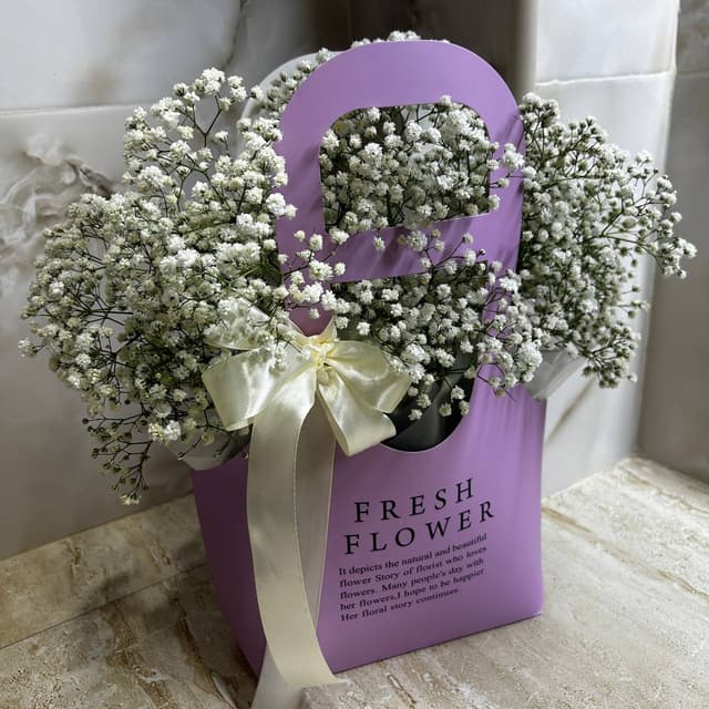 Handbag with white gypsophila