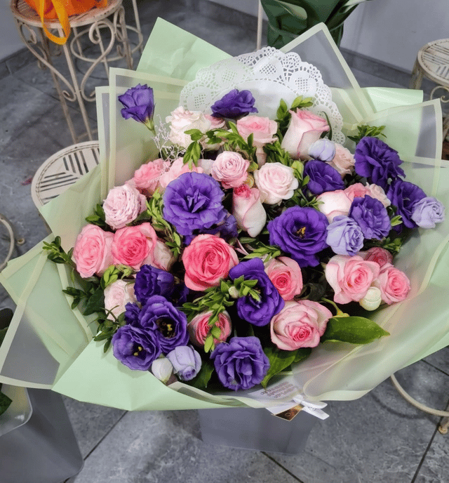 Floral arrangement in a basket - Amela Rose
